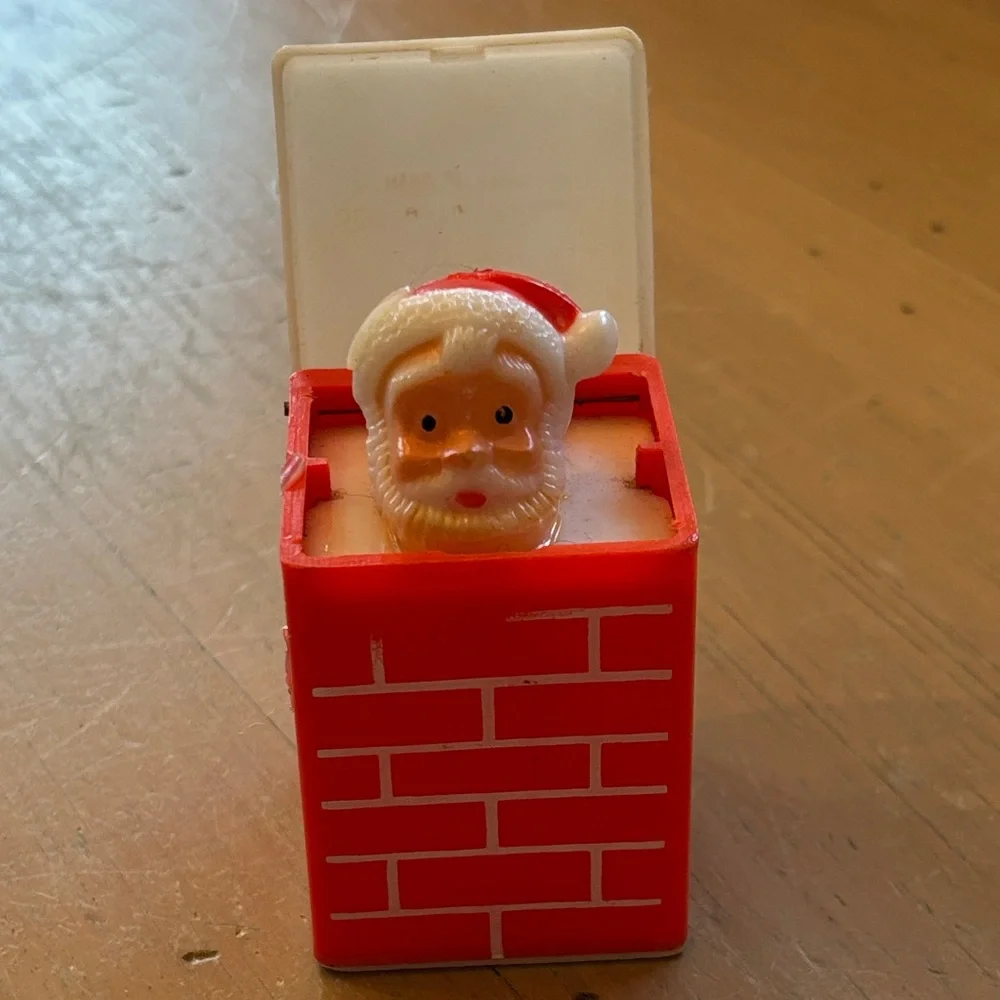 Vintage Pop-Up Squeaky Toy Santa in Chimney